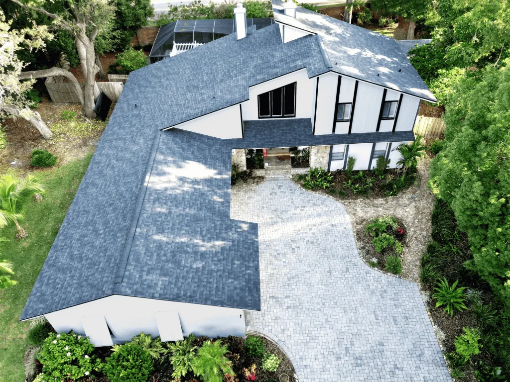 Bela Roofing shingled roof home white with gray roof